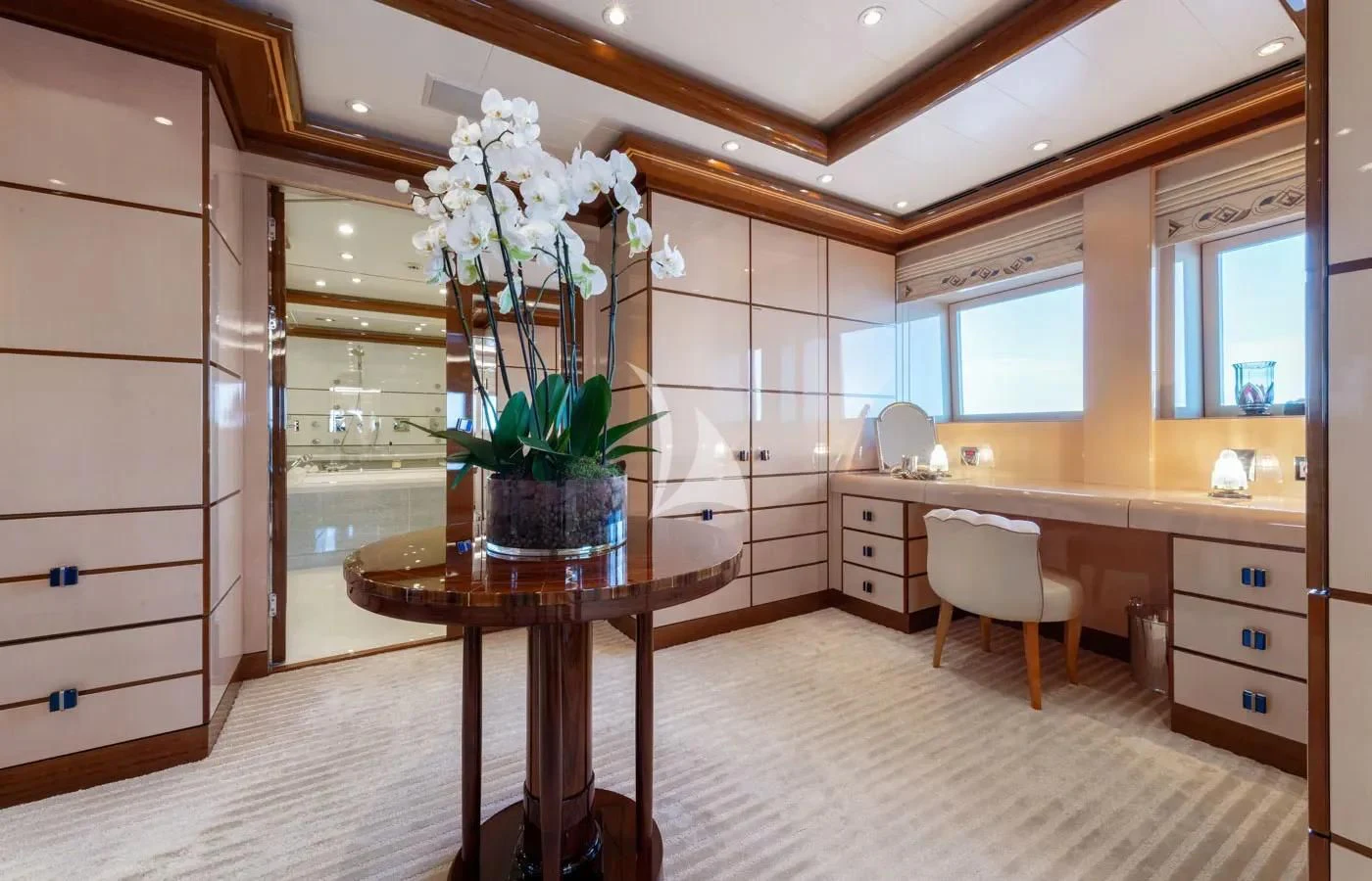 a kitchen with a table and chairs aboard BATELLO Yacht for Sale