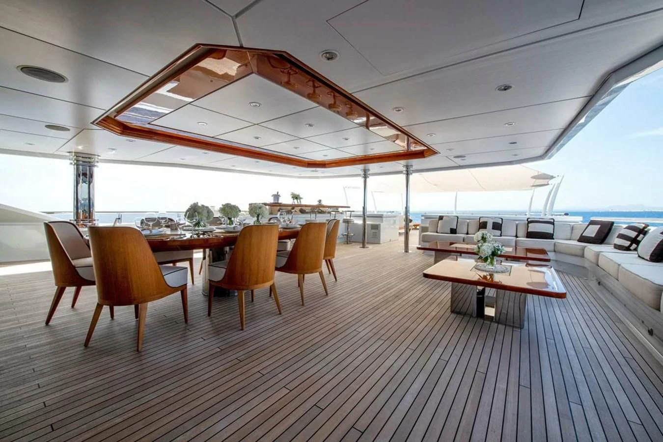 a room with a table and chairs aboard BATELLO Yacht for Sale