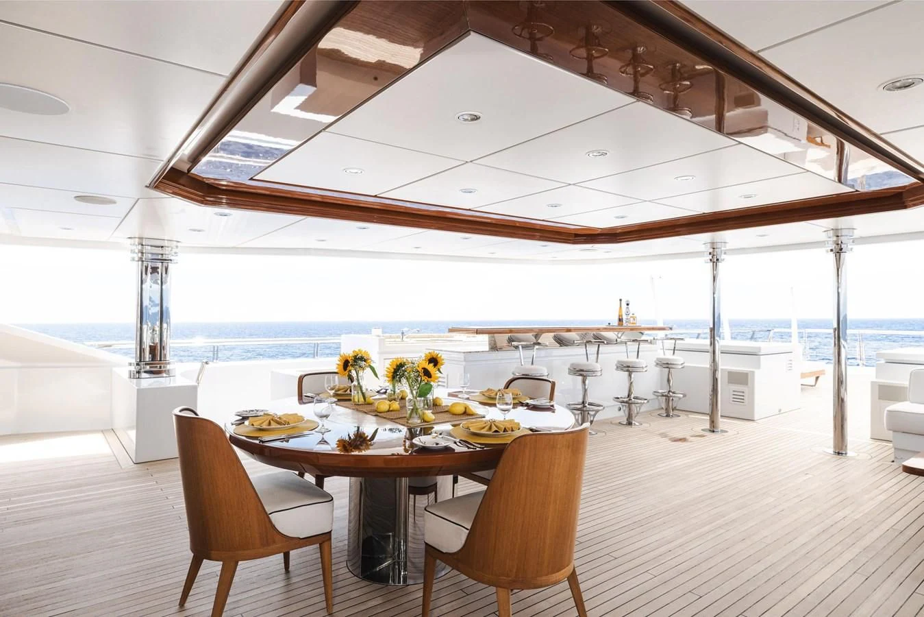 a large dining table with chairs aboard BATELLO Yacht for Sale