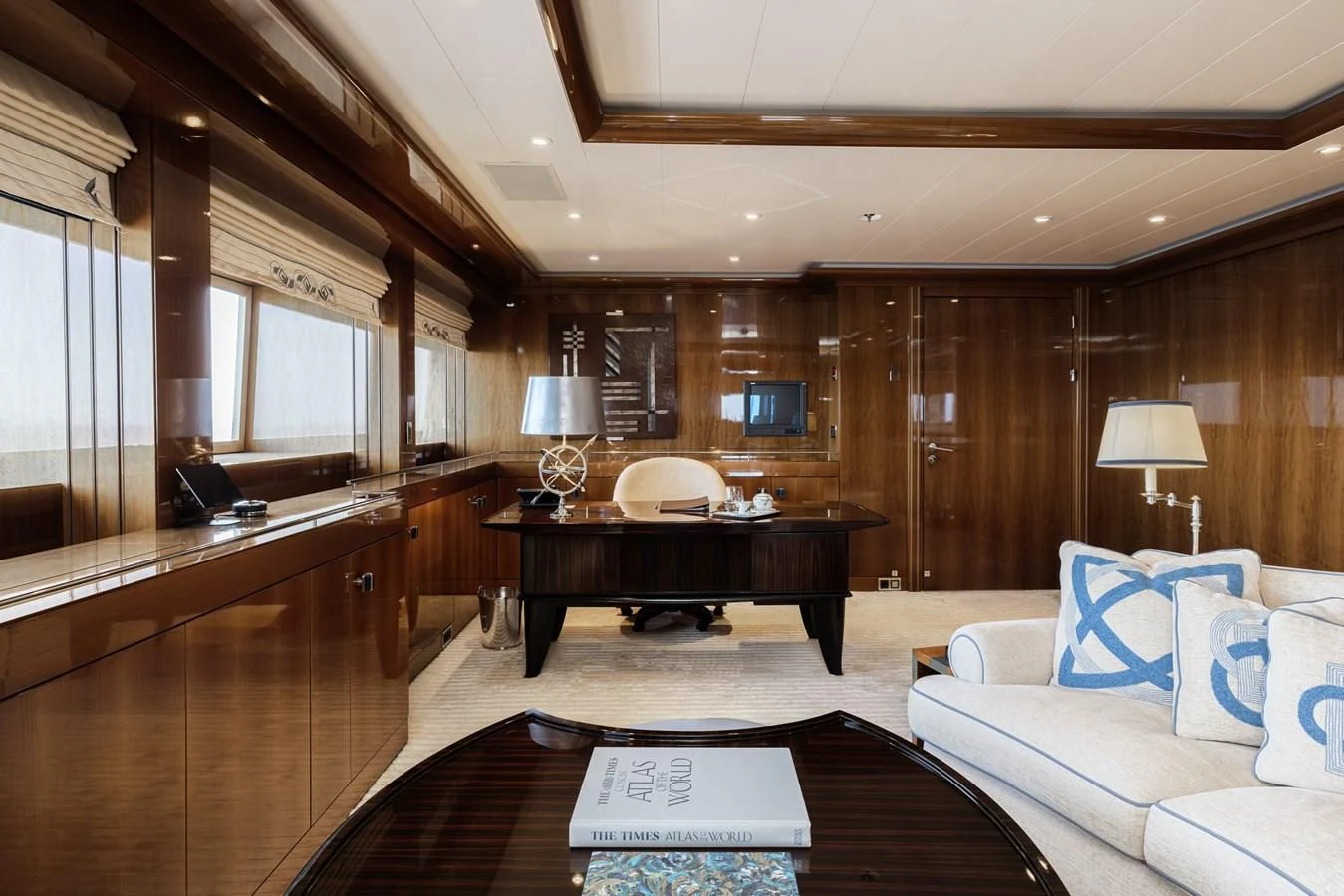 a large living room with wood walls aboard BATELLO Yacht for Sale
