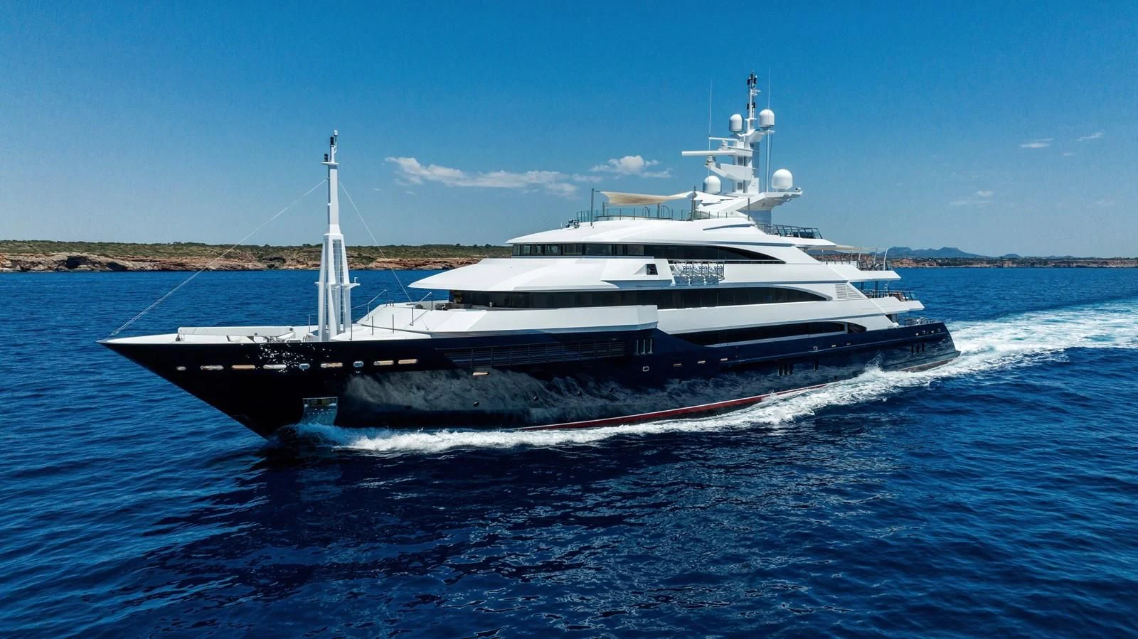 a large white boat on the water aboard BATELLO Yacht for Sale