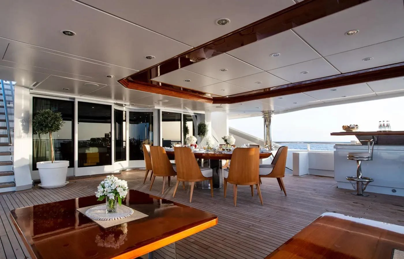 a modern looking room with a table and chairs aboard BATELLO Yacht for Sale