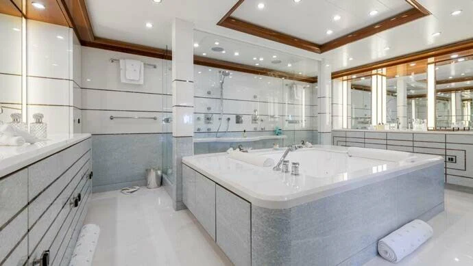 a large bathroom with a large bathtub aboard BATELLO Yacht for Sale
