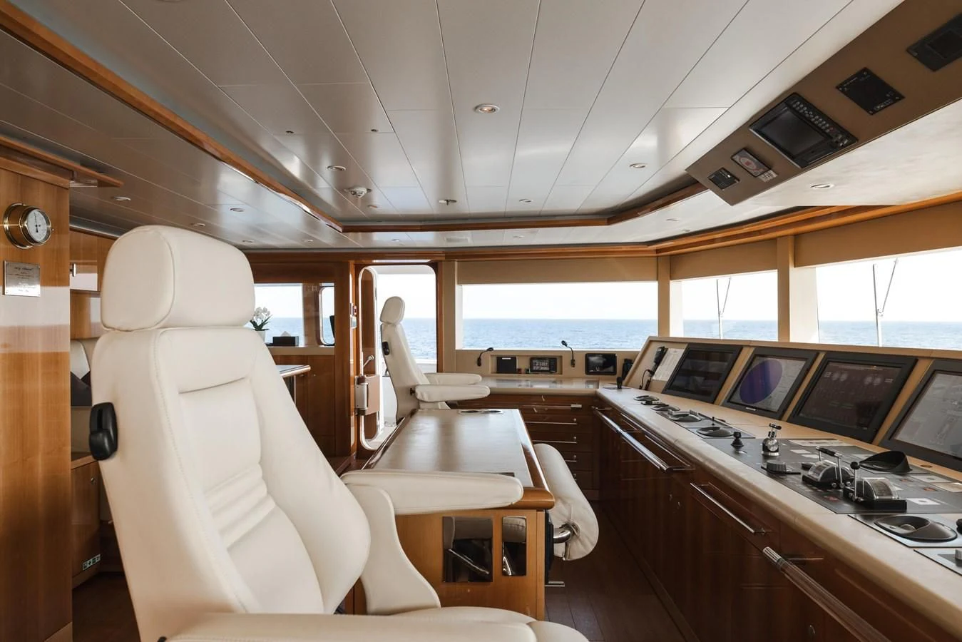 a room with a table and chairs aboard BATELLO Yacht for Sale