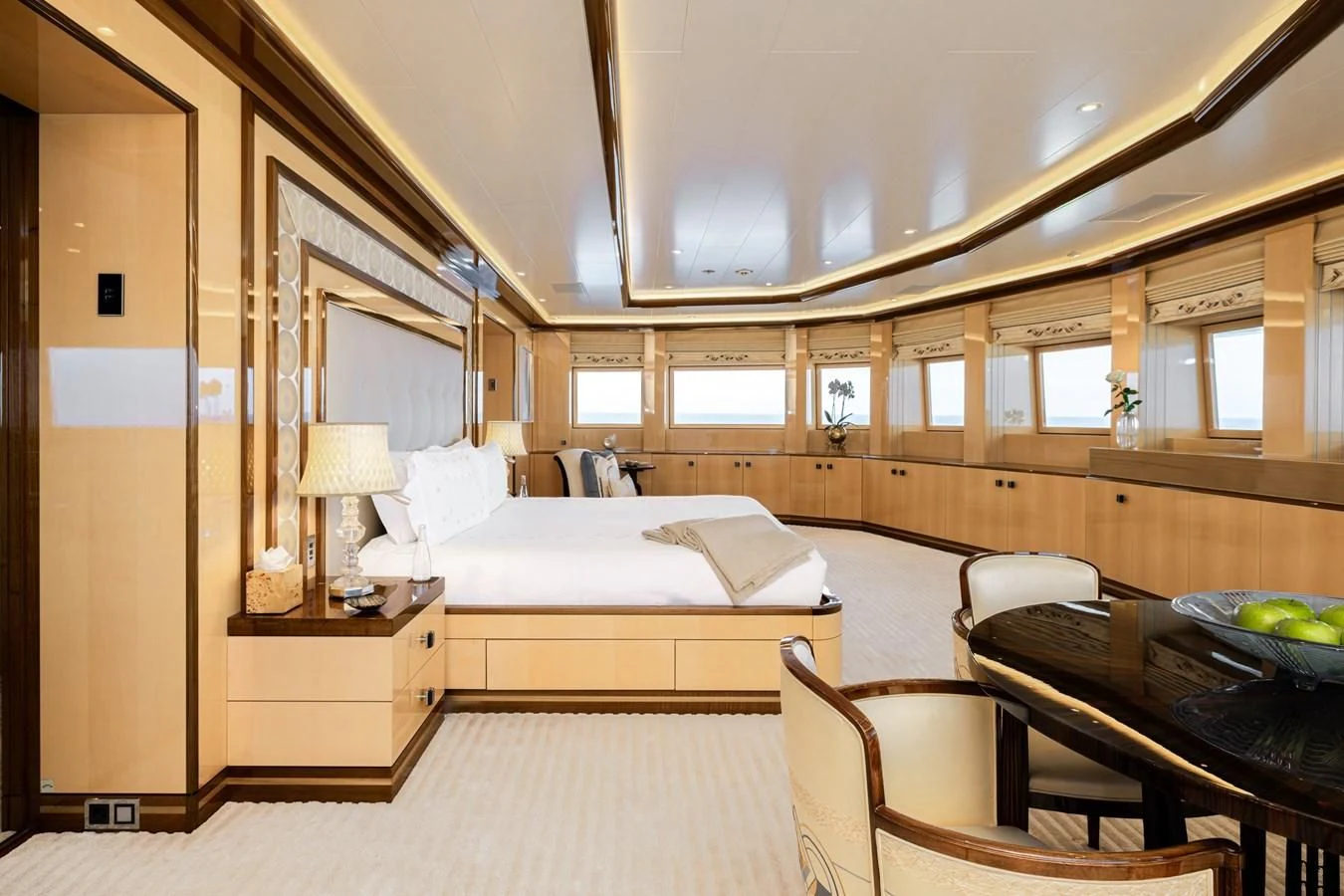 a bedroom with a bed and a desk aboard BATELLO Yacht for Sale