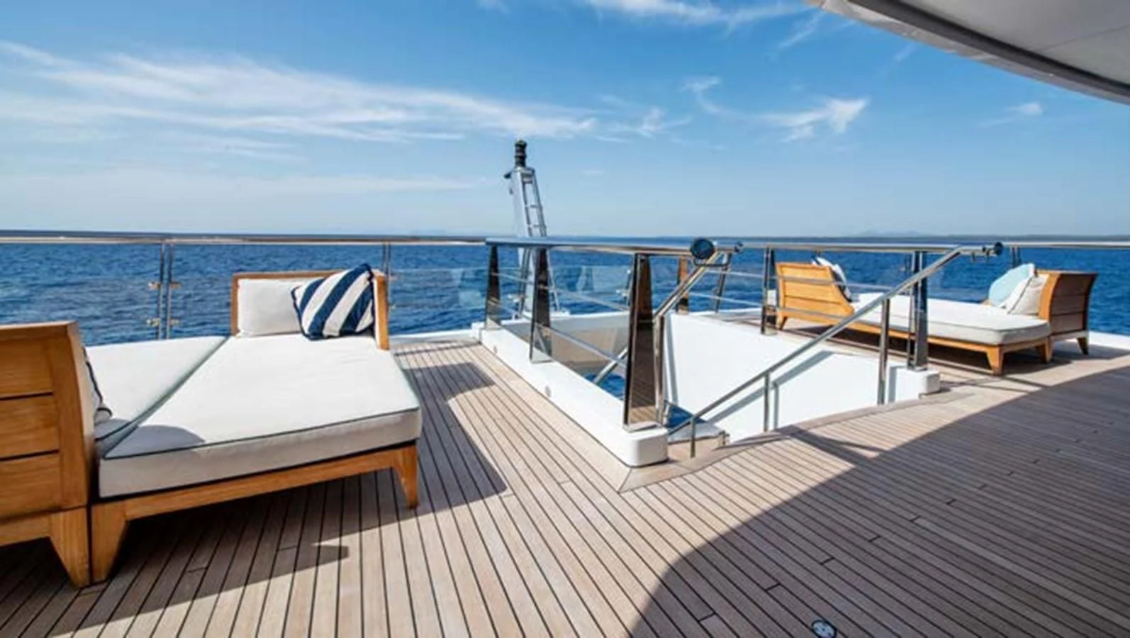 a deck with beds on it aboard BATELLO Yacht for Sale