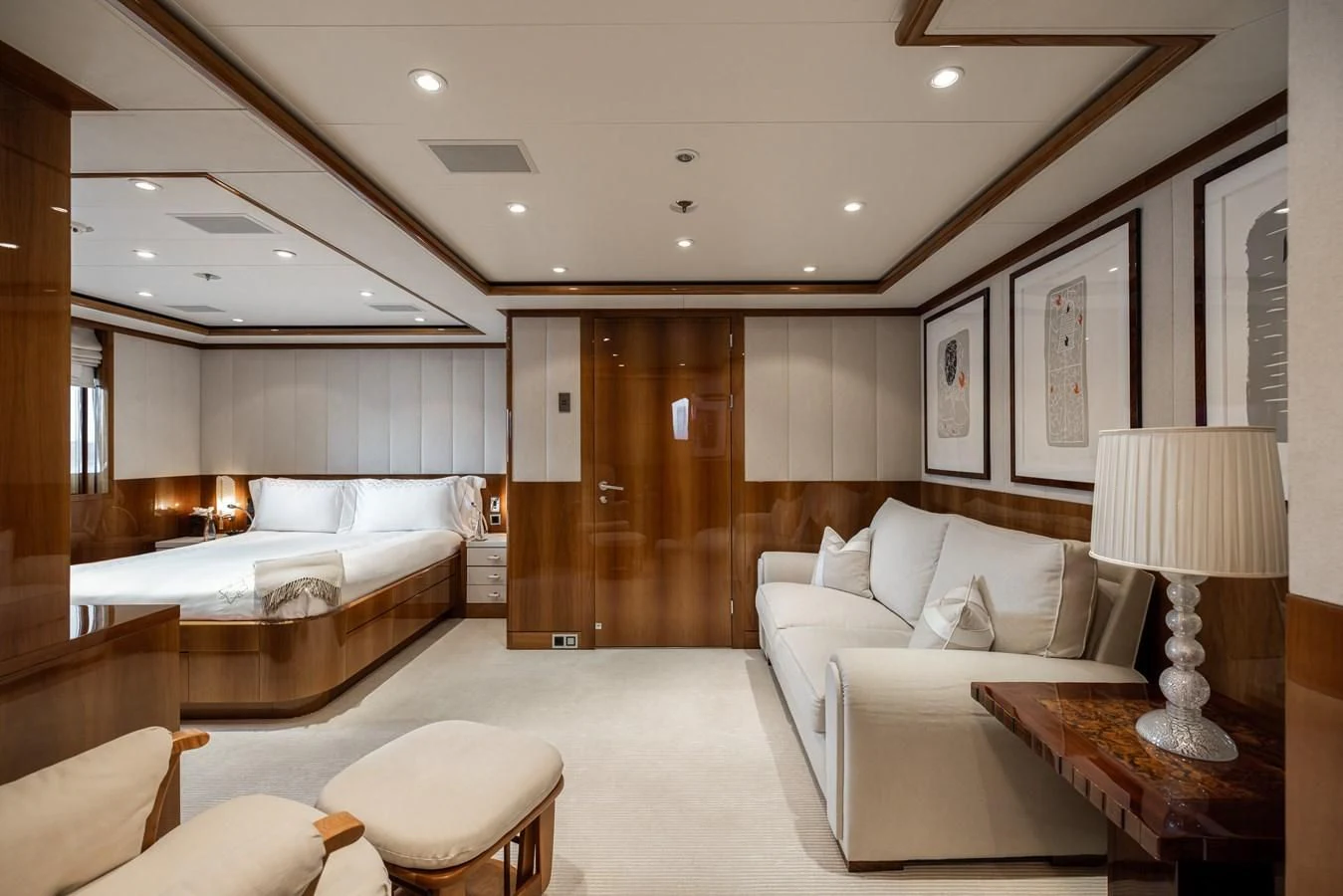 a modern bedroom with a bed and a desk aboard BATELLO Yacht for Sale