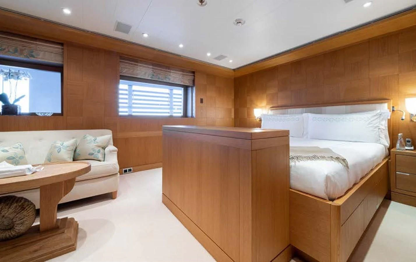 a room with a bed and a couch aboard BATELLO Yacht for Sale