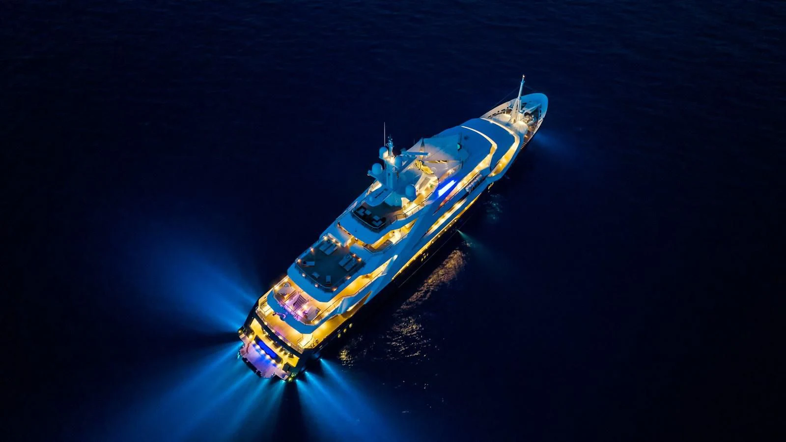 a blue and yellow boat aboard BATELLO Yacht for Sale