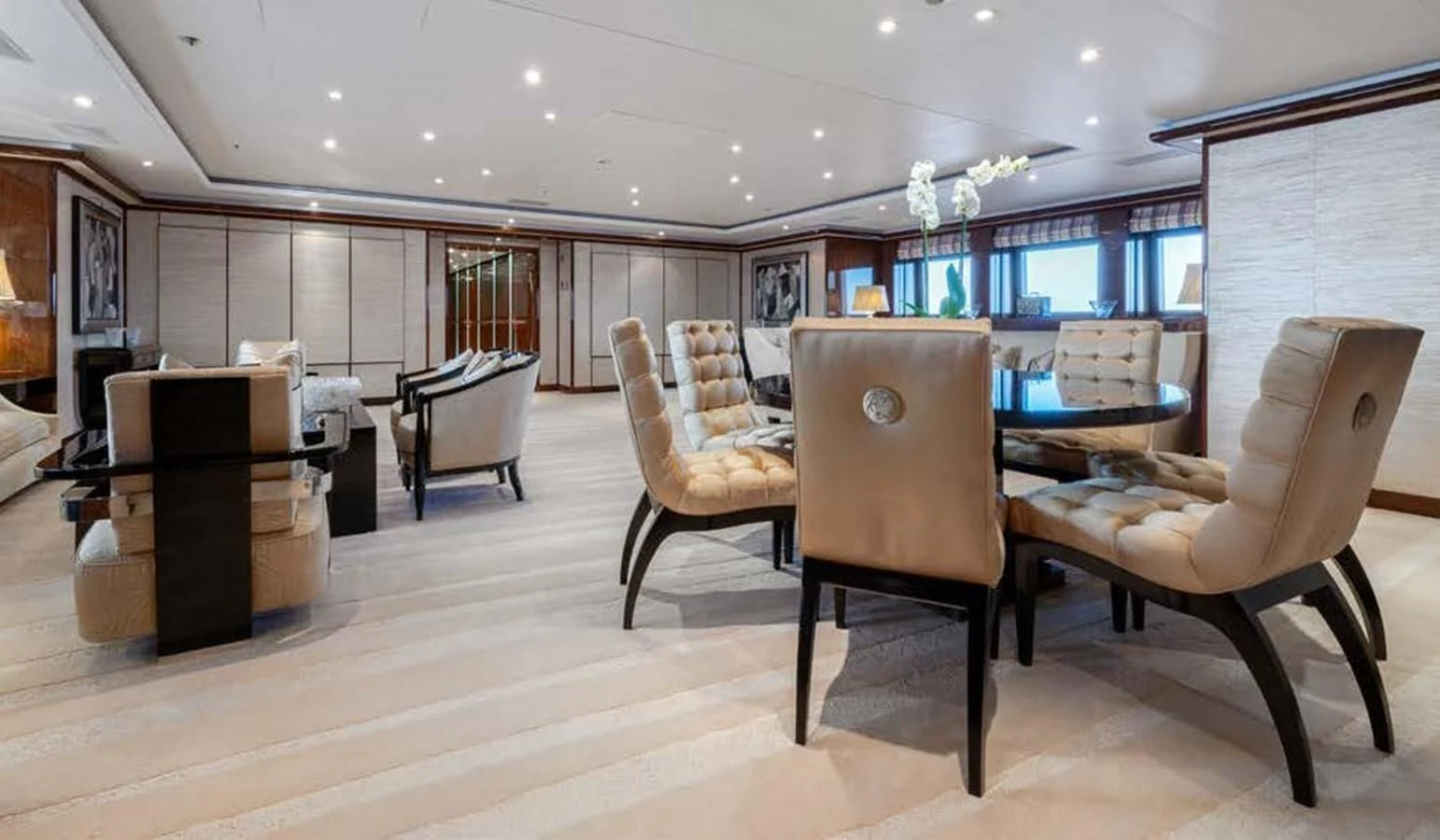 a room with chairs and a piano aboard BATELLO Yacht for Sale