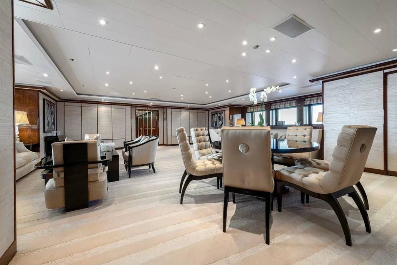 a room with a table chairs and a tv aboard BATELLO Yacht for Sale