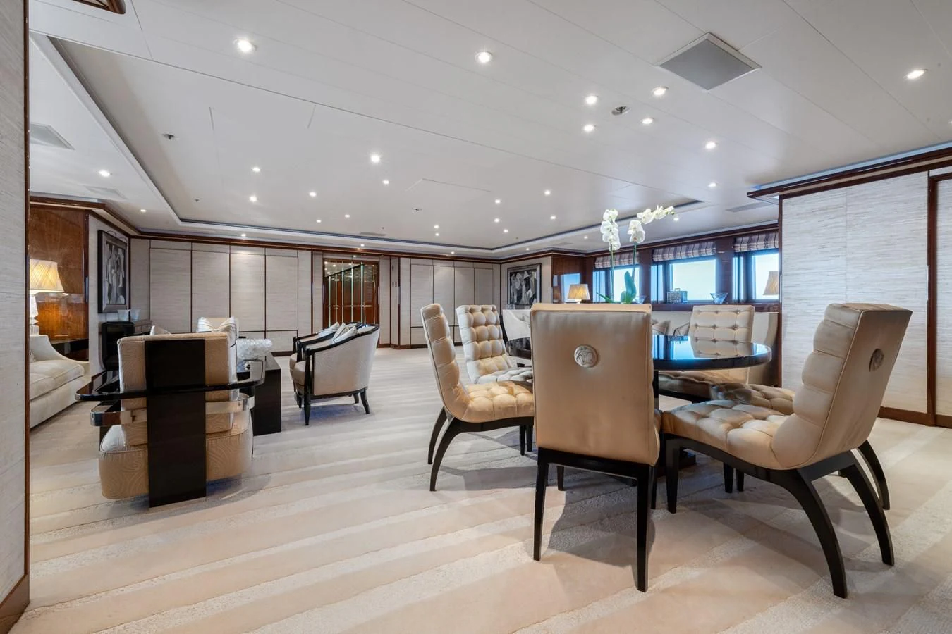 a room with a table chairs and a tv aboard BATELLO Yacht for Sale