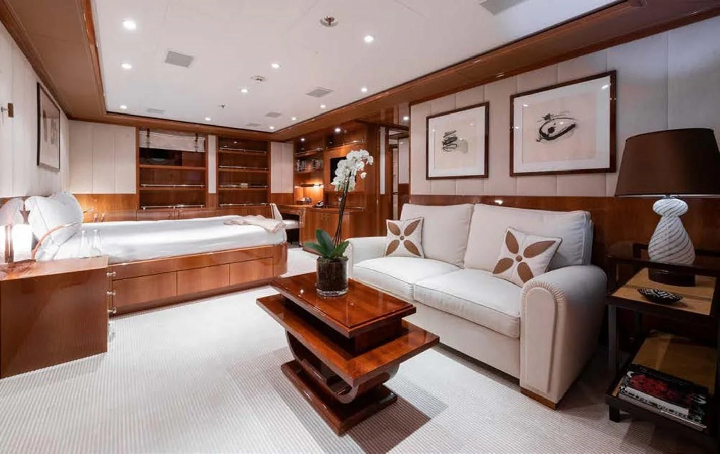 a living room with a bed and a coffee table aboard BATELLO Yacht for Sale