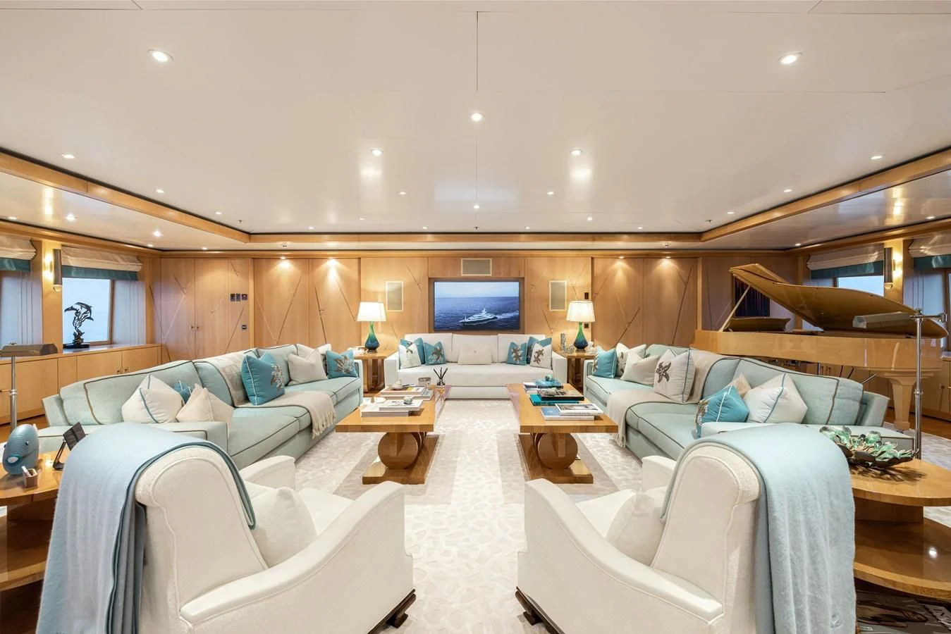 a large room with a bed and a couch aboard BATELLO Yacht for Sale