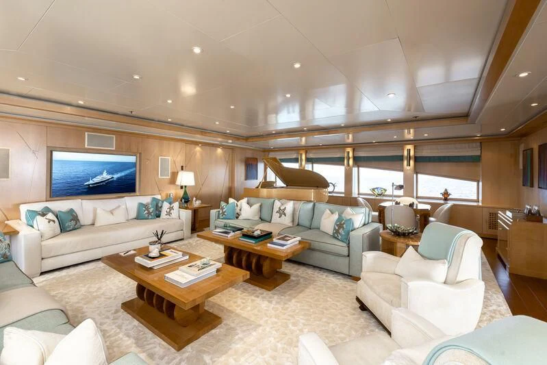 a living room with a large screen aboard BATELLO Yacht for Sale