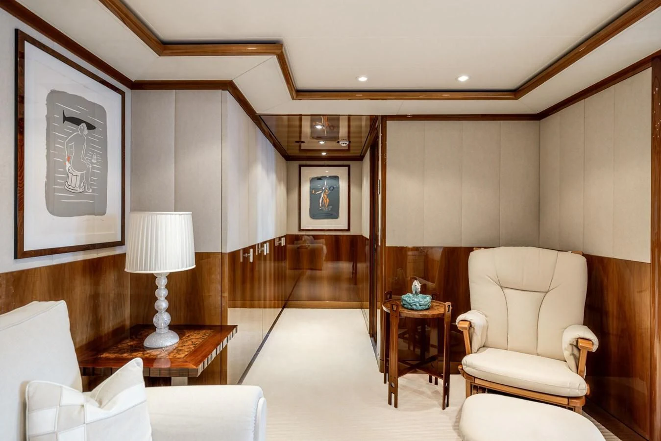 a living room with a wood floor aboard BATELLO Yacht for Sale