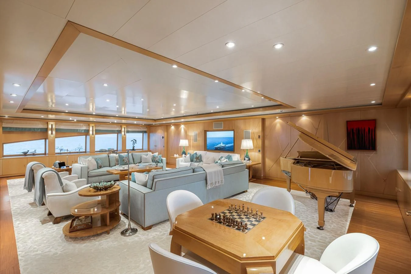 a living room with a large window aboard BATELLO Yacht for Sale