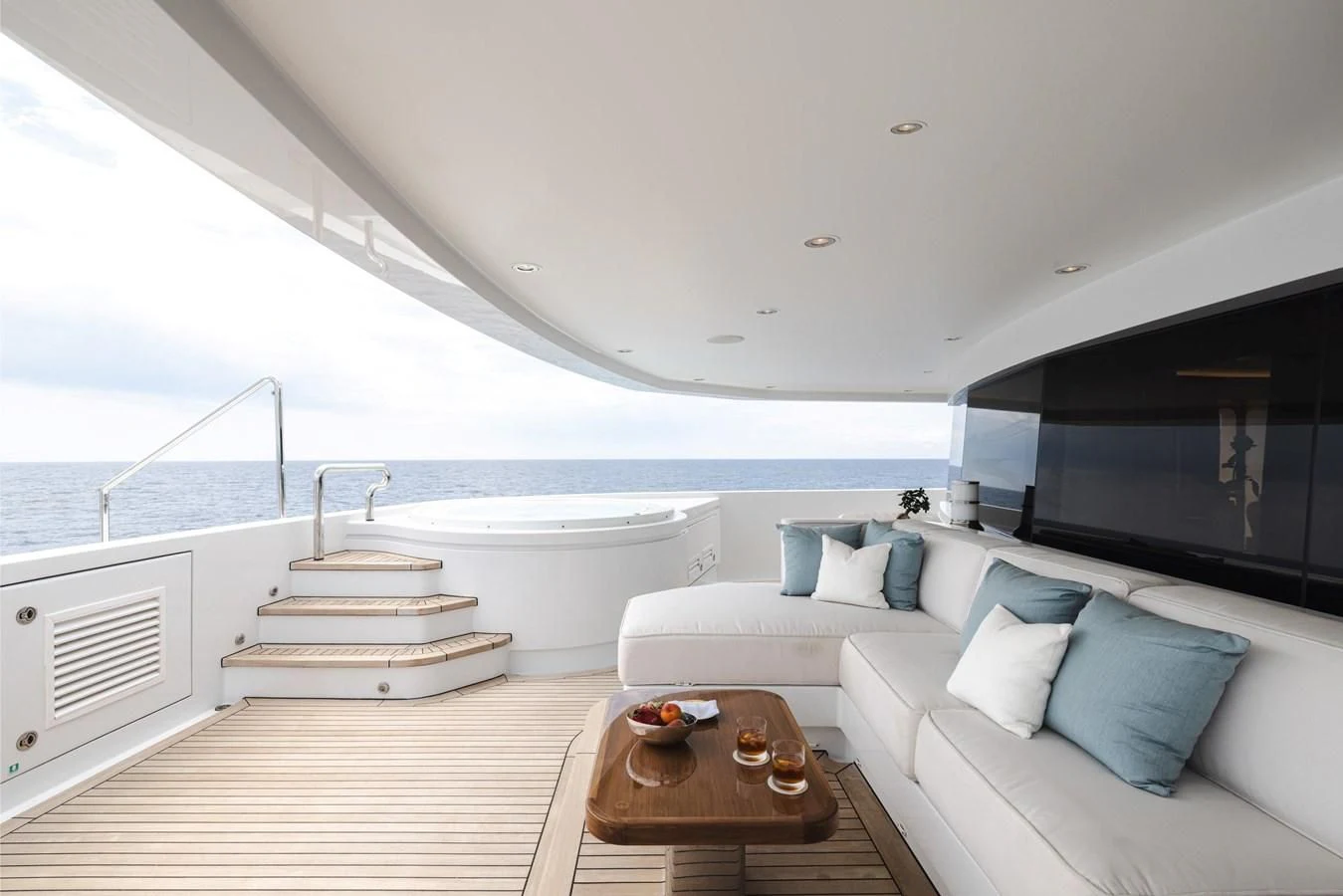 a modern living room with a large balcony aboard BATELLO Yacht for Sale