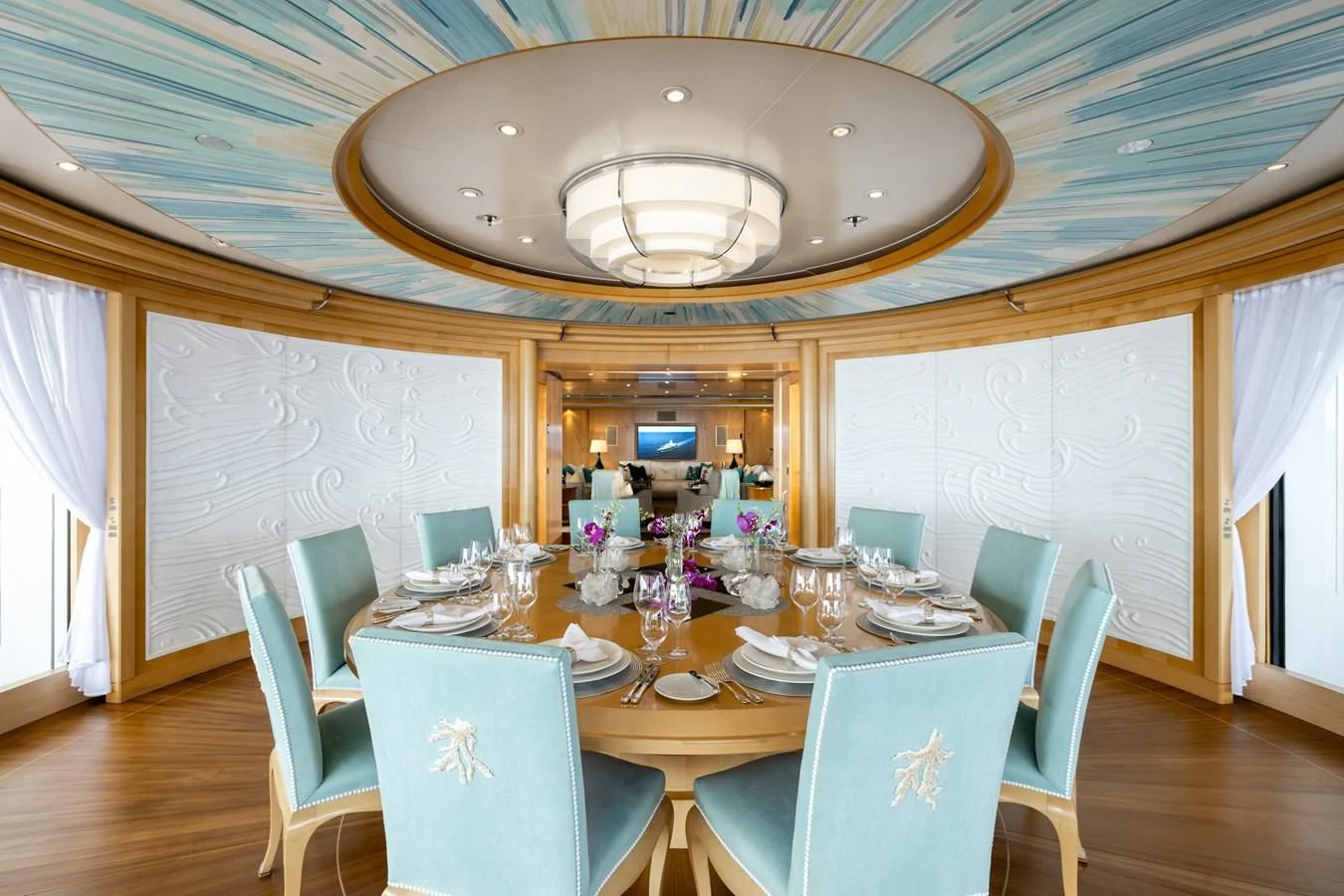 a dining room with a table and chairs aboard BATELLO Yacht for Sale