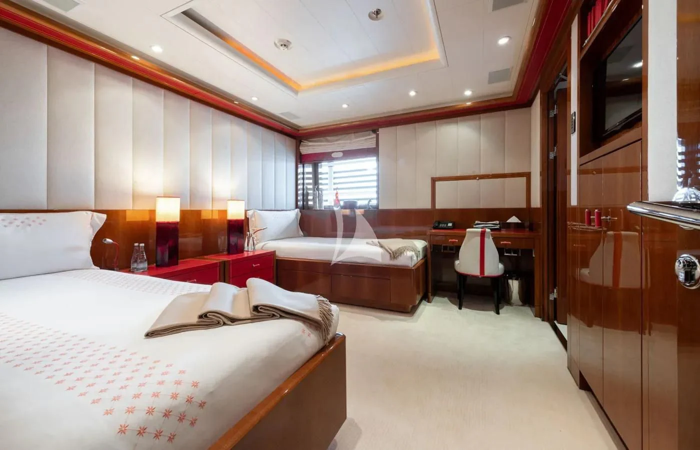 a room with a bed and a desk aboard BATELLO Yacht for Sale