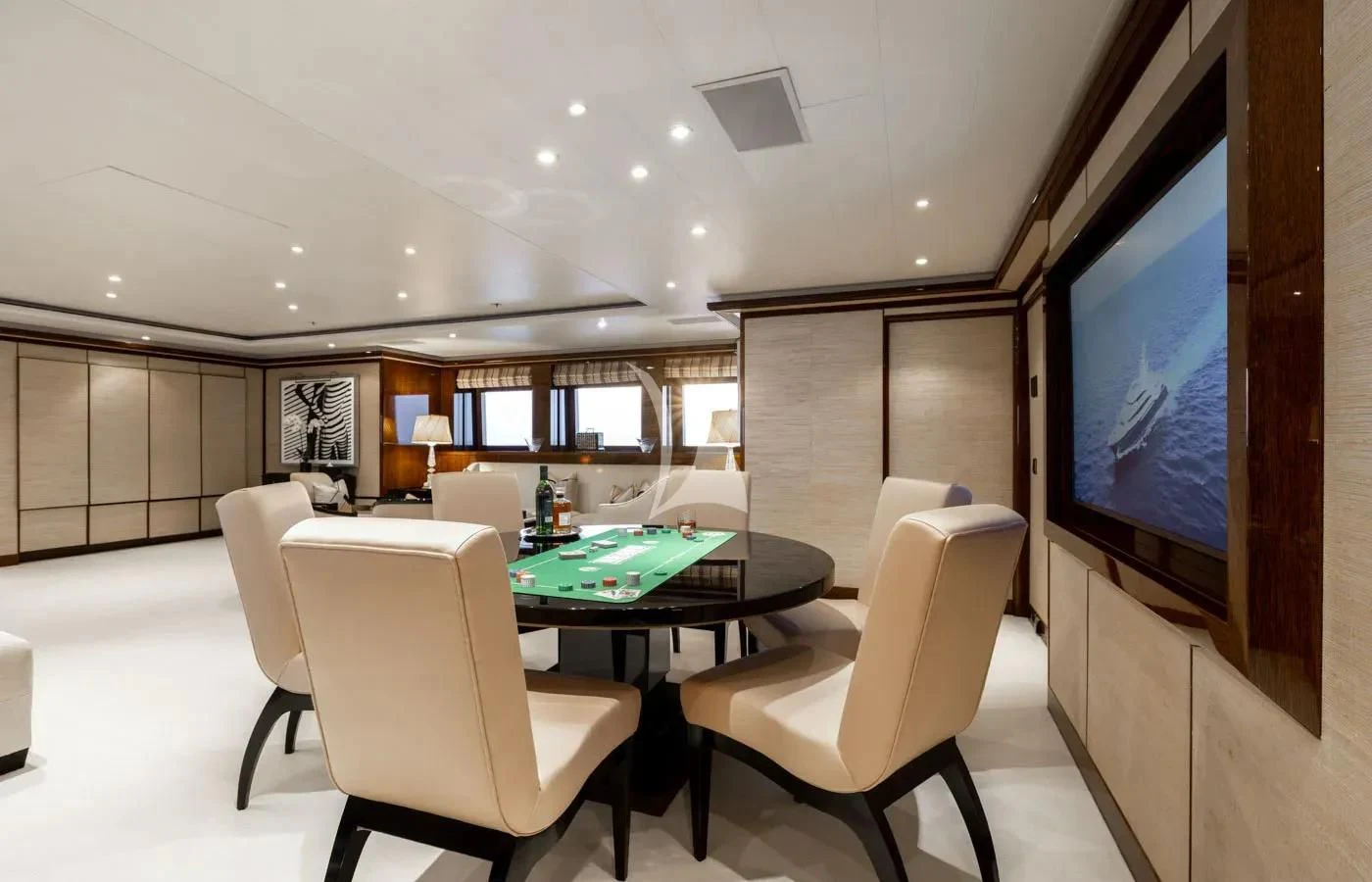 a room with a table and chairs aboard BATELLO Yacht for Sale