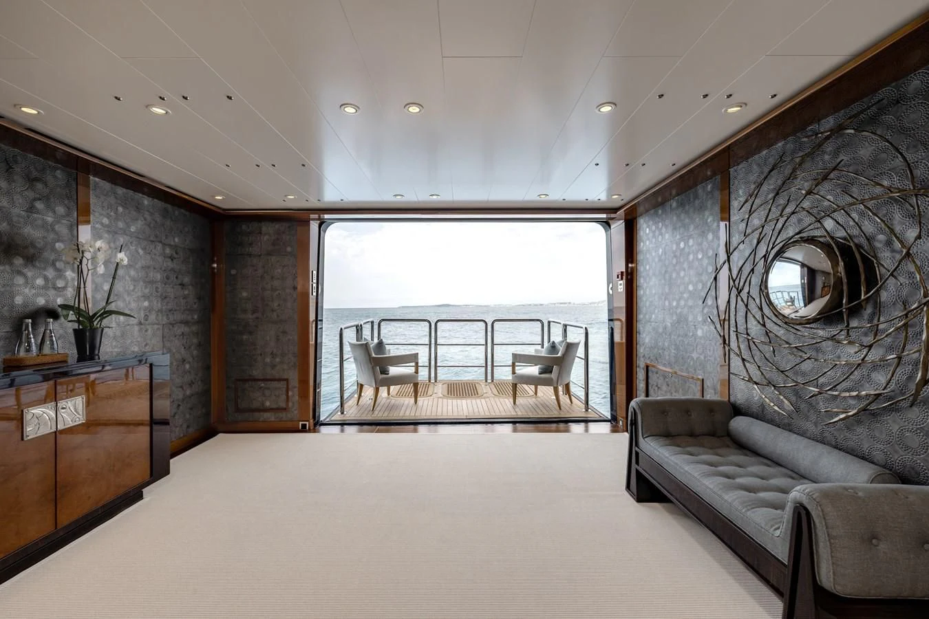 a room with a couch and a table and chairs aboard BATELLO Yacht for Sale