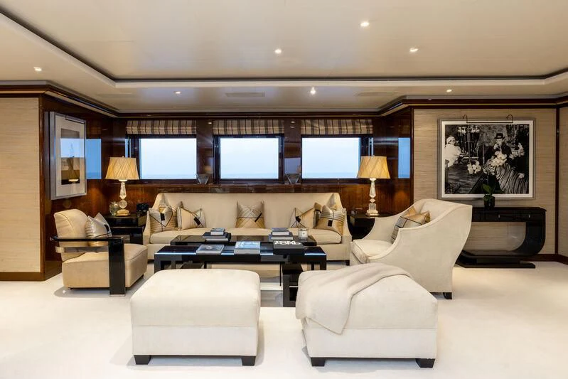 a living room with a large screen aboard BATELLO Yacht for Sale