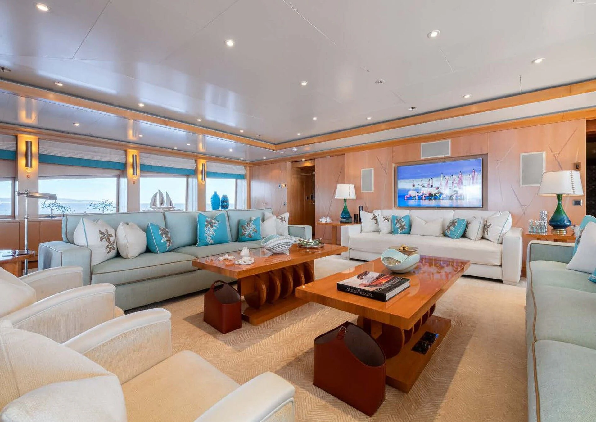 a living room with a large screen aboard BATELLO Yacht for Sale
