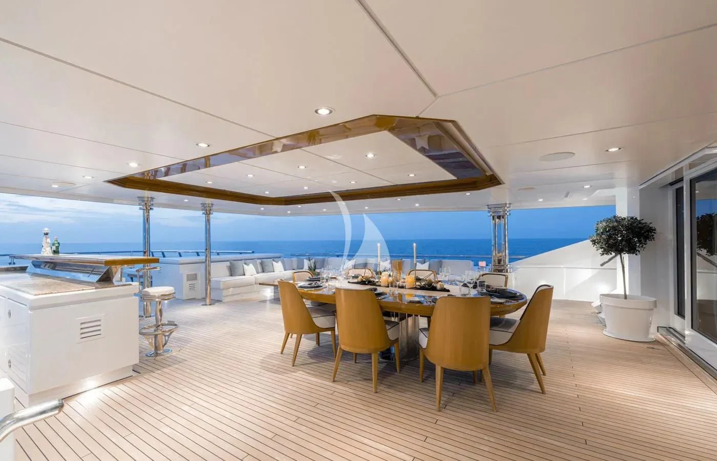 a large room with tables and chairs aboard BATELLO Yacht for Sale