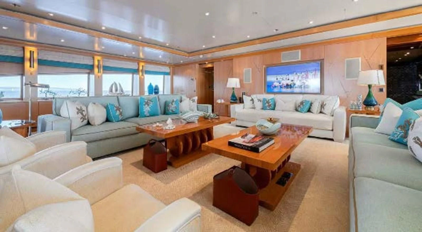 a living room with a large screen aboard BATELLO Yacht for Sale