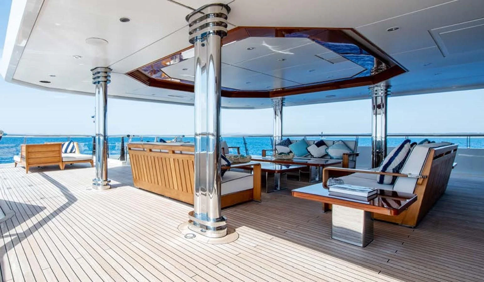 a room with a table and chairs aboard BATELLO Yacht for Sale