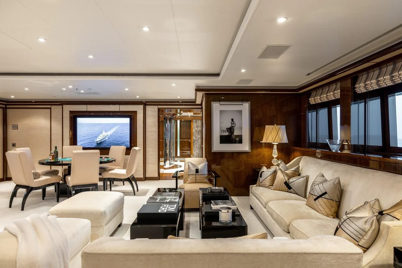 a living room with a couch and a table aboard BATELLO Yacht for Sale