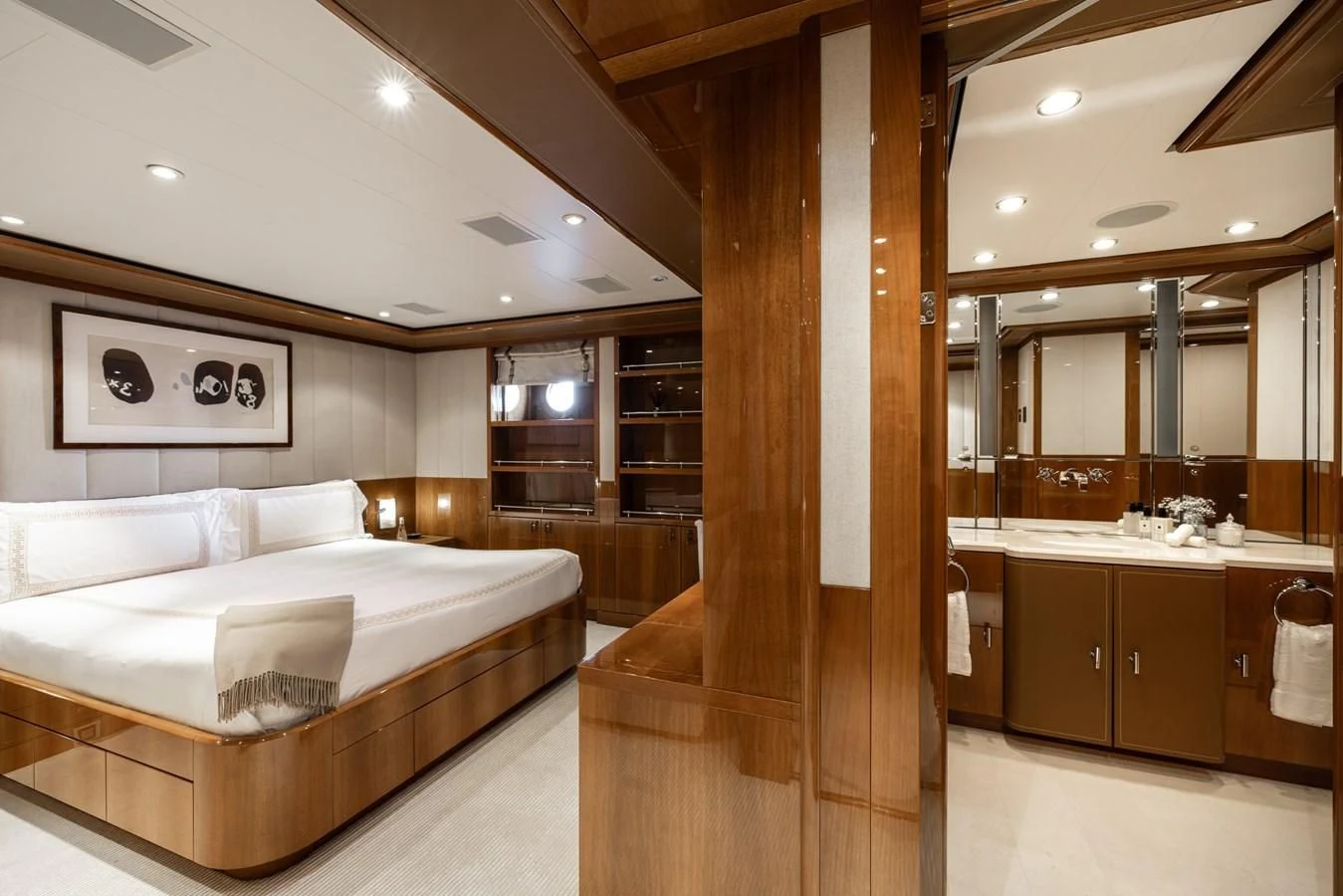 a room with a bed and a mirror aboard BATELLO Yacht for Sale