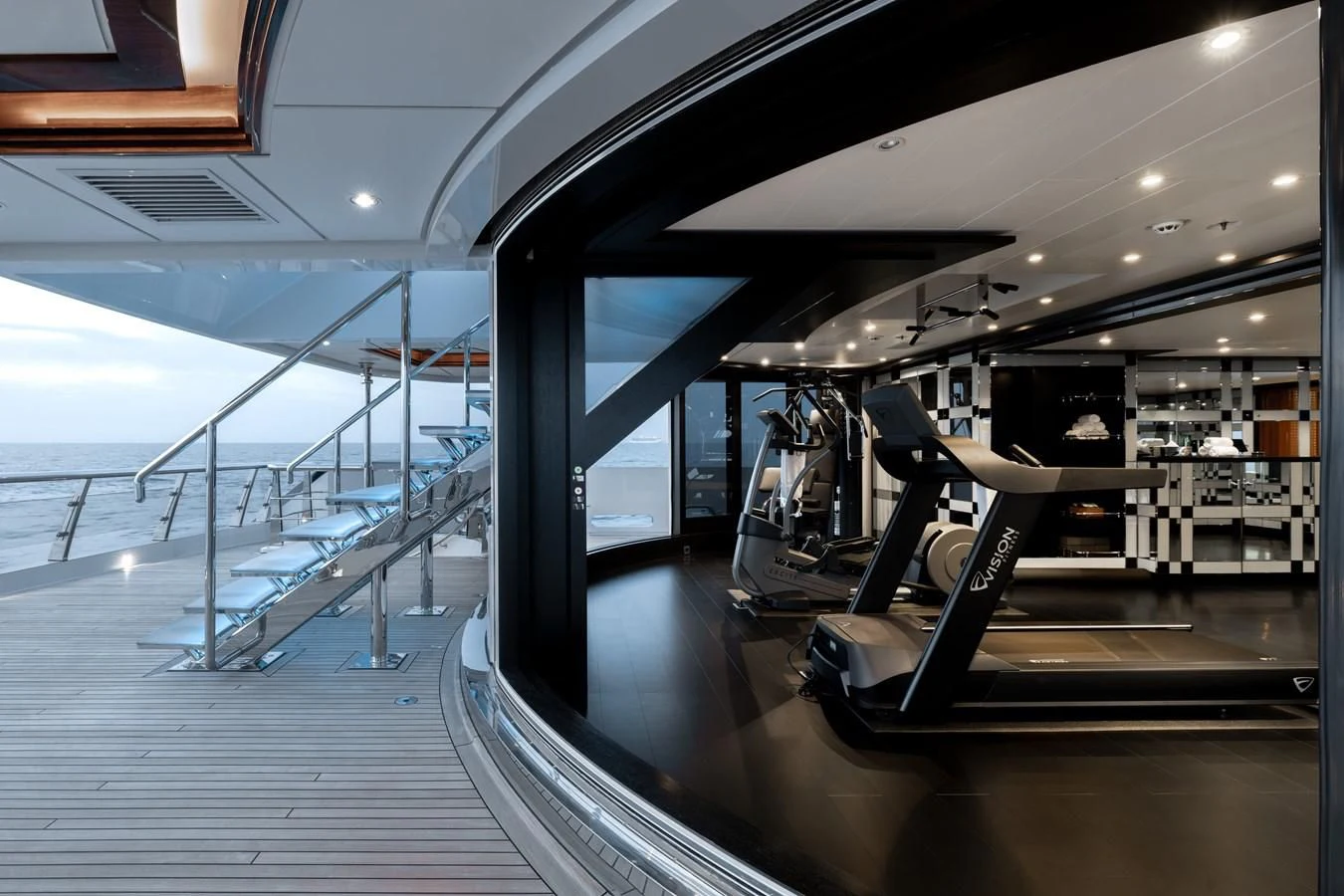 a treadmill in a gym aboard BATELLO Yacht for Sale