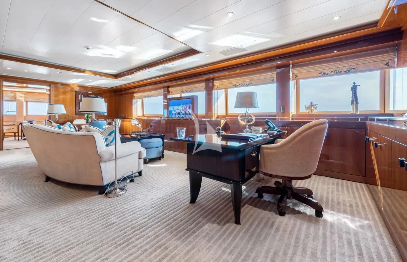 a living room with a couch and a table aboard BATELLO Yacht for Sale