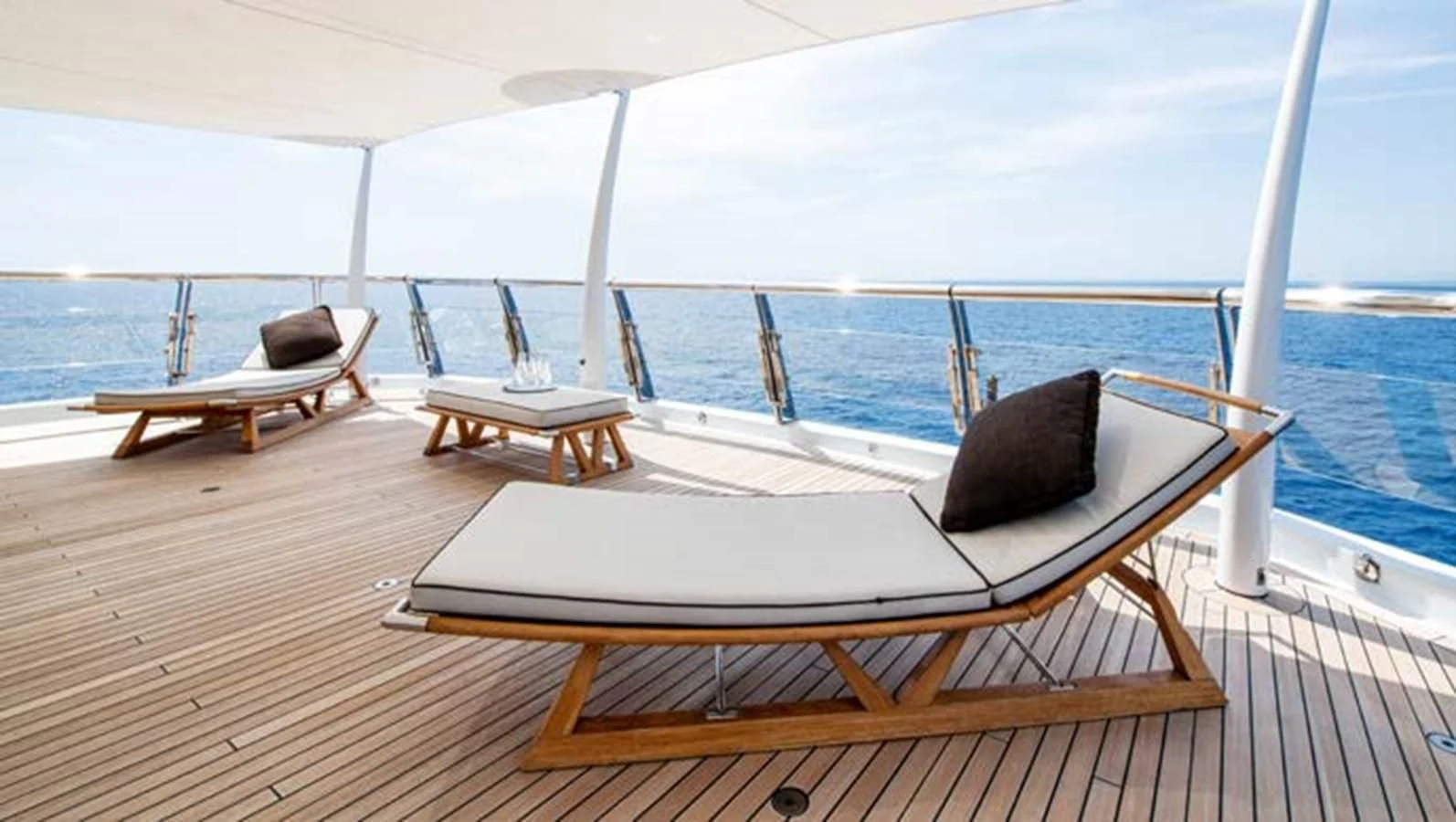a lounge chair on a deck aboard BATELLO Yacht for Sale