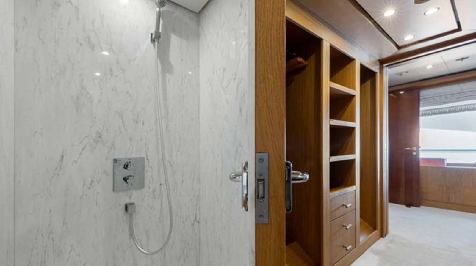 a room with a door and a mirror aboard BATELLO Yacht for Sale
