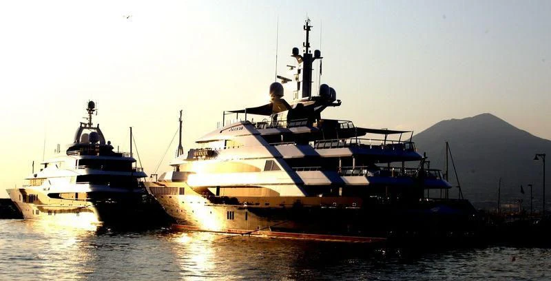 a couple of large ships in the water aboard BATELLO Yacht for Sale