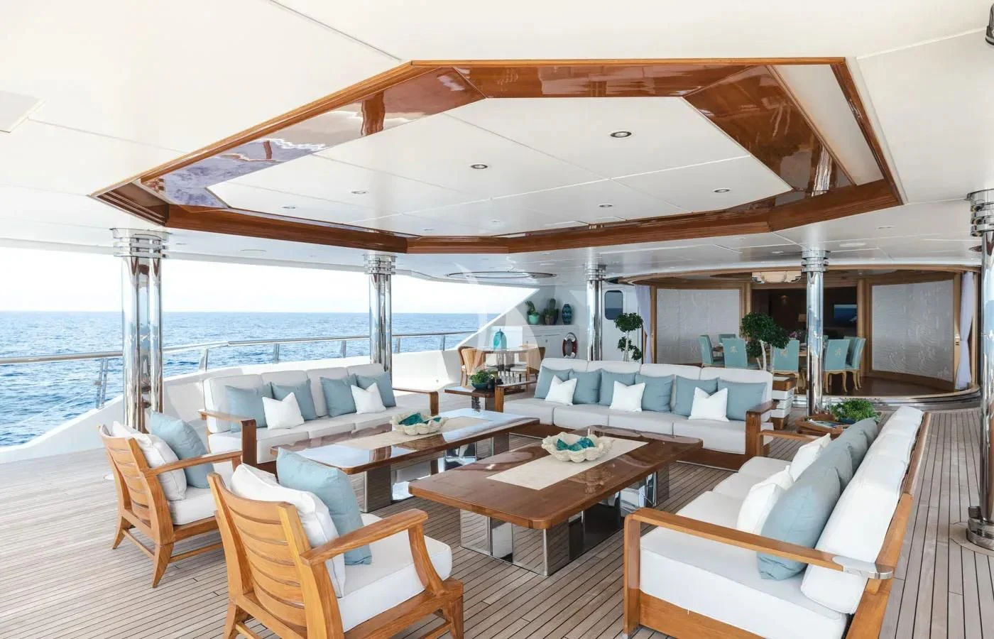 a large living room with a large balcony overlooking the ocean aboard BATELLO Yacht for Sale