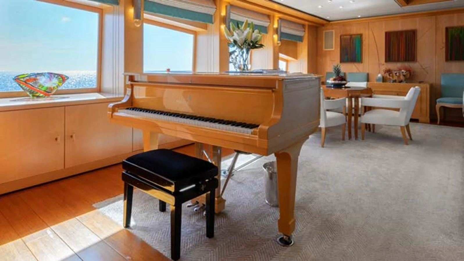 a piano in a room aboard BATELLO Yacht for Sale