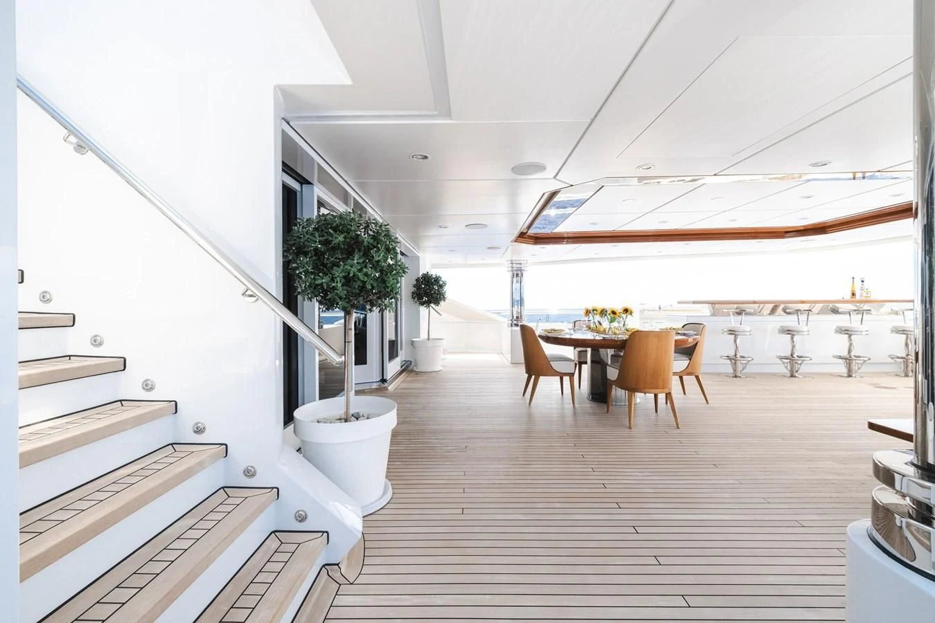 a room with a table and chairs aboard BATELLO Yacht for Sale