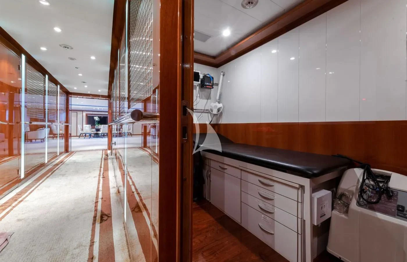 a room with a wood floor and cabinets and a wood floor aboard BATELLO Yacht for Sale