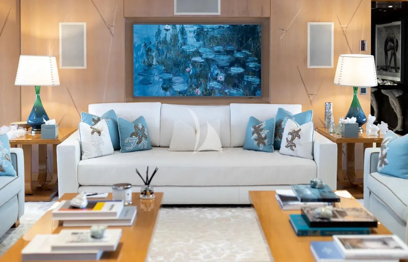 a living room with a large painting aboard BATELLO Yacht for Sale