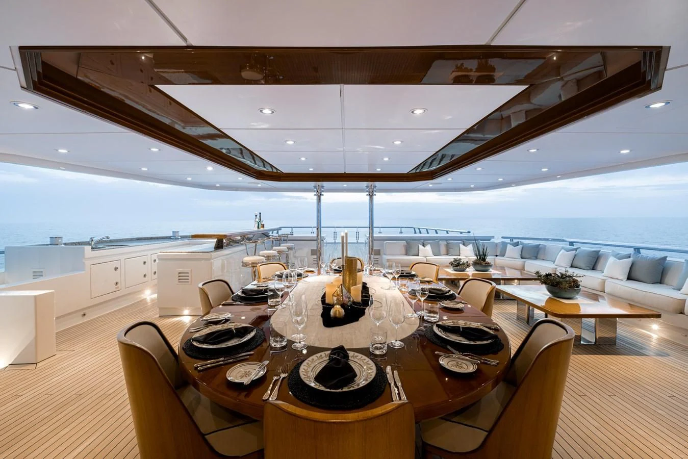 a large room with a table and chairs aboard BATELLO Yacht for Sale
