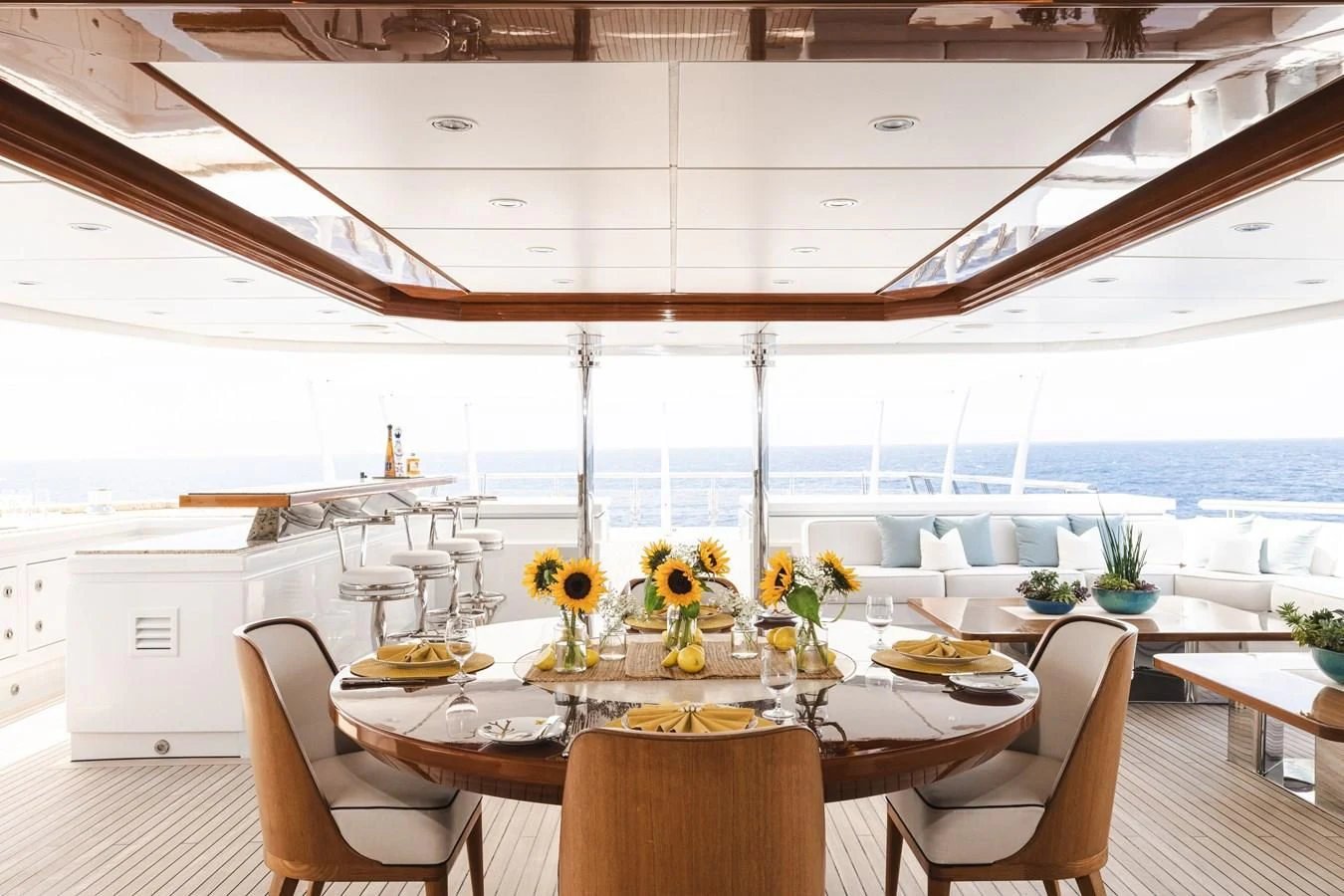 a large white room with a table and chairs and a large white ceiling aboard BATELLO Yacht for Sale
