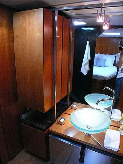 a bathroom with a sink and a mirror aboard WALLY B Yacht for Sale