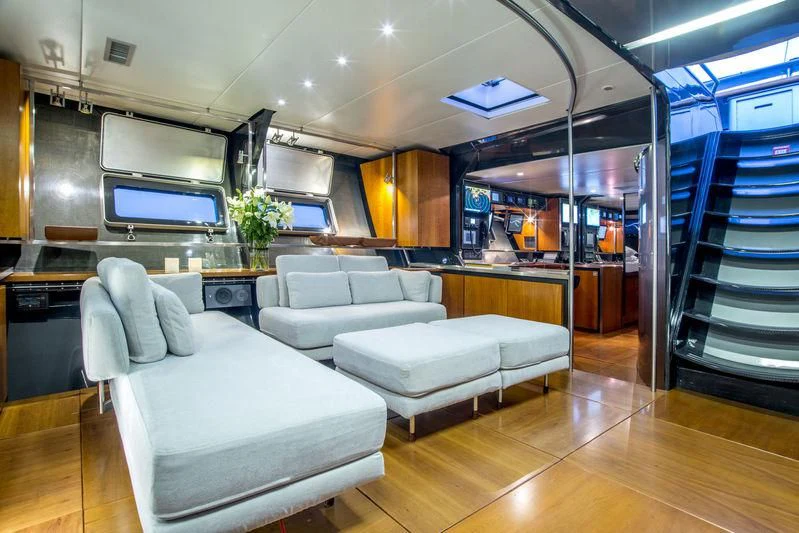a room with couches and a ladder aboard WALLY B Yacht for Sale