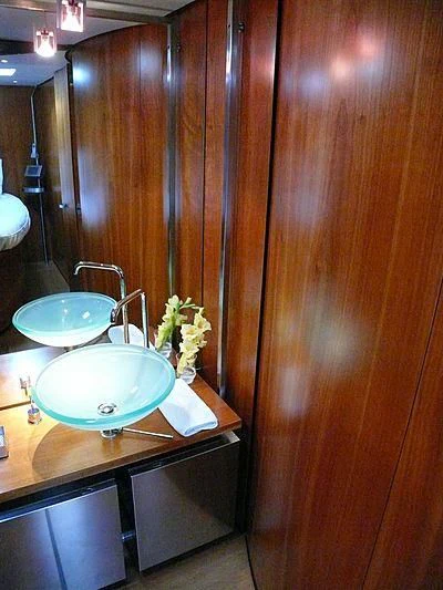 a bathroom with a sink and a mirror aboard WALLY B Yacht for Sale