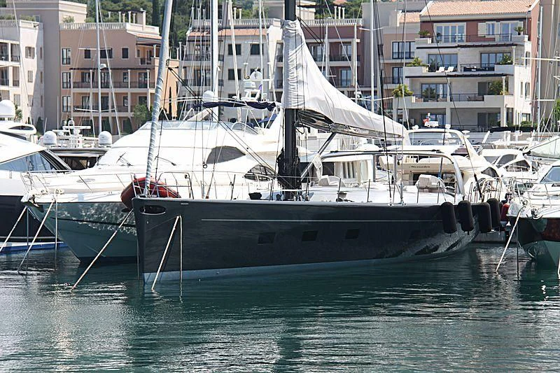 a boat docked at a pier aboard WALLY B Yacht for Sale