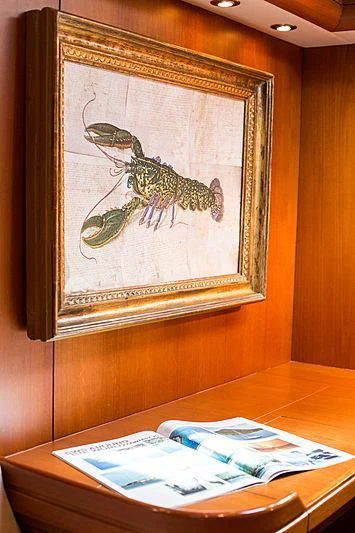 a painting on a wall aboard PAN Yacht for Sale